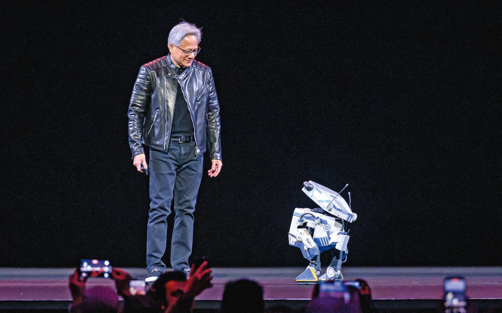 英偉達老闆黃仁勳在GTC大會中與機器人「Blue」互動為全球一大亮點,他更高呼︰「通用機械人時代來臨!」 英偉達老闆黃仁勳在GTC大會中與機器人「Blue」互動為全球一大亮點,他更高呼︰「通用機械人時代來臨!」